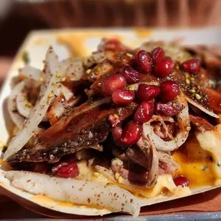 a plate of food with meat and vegetables