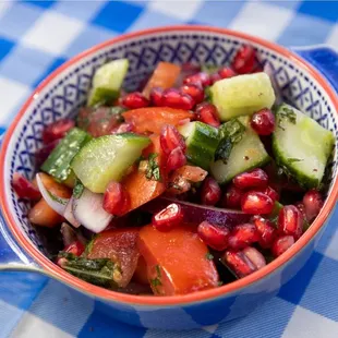 Egyptian Baladi Salad - tomatoes, cucumbers, pickled red onion, and pomegranate seeds soaked in a Mediterranean vinegar sauce