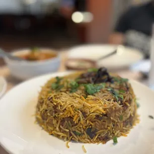 a plate of rice and vegetables