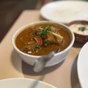 a bowl of curry and a plate of rice