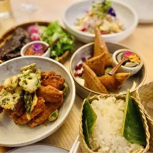 Cute touches of banana leaves and bamboo rice vessel.