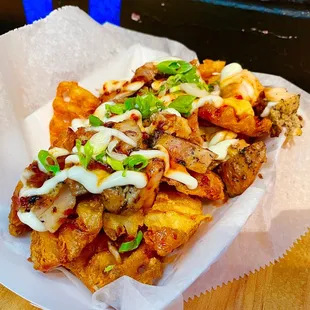 Drunken Fries - slow roasted pork and grilled chicken with an assortment of delicious sauces on crispy waffle fries. Delicious!!