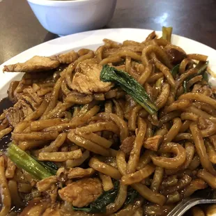 Noodle dish with a dark sweet sauce and various meats