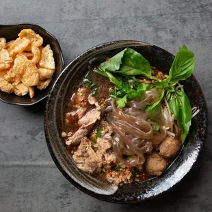 The special of boat noodle soup with sweet potato noodles. Comes with the choice of beef or pork with meatballs, bean sprouts, Chinese brocc