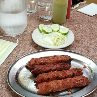 Seekh kababs with condiments