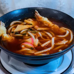 a bowl of soup with noodles and vegetables