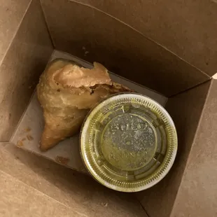 There is two samosas, I already ate one  the sauce they come with is great!