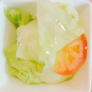 a salad in a white bowl