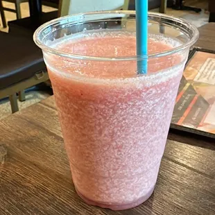 a smoothie in a plastic cup