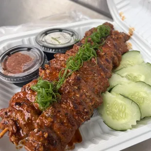 Beef skewers with sticky rice.