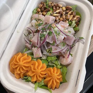 a salad in a styrofoam container