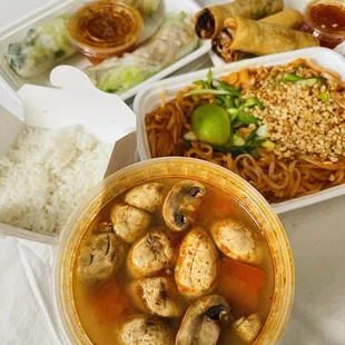 Thom Yum Po-Tak (front) Pad Thai (right) Spring Rolls (back left), Egg Rolls (back right)