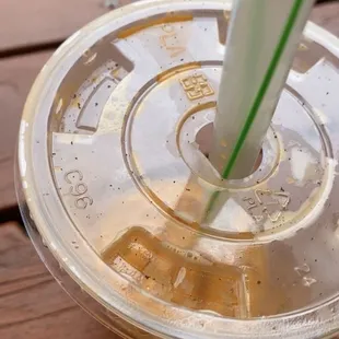 a drink in a plastic cup with a straw