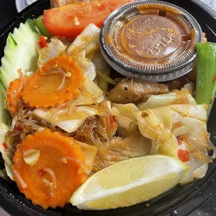 Pad Woon Sen with pork - clear glass noodles underneath all of those fresh veggies, and tons of meat! We ordered ours extra spicy