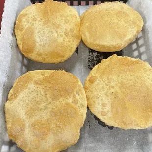 four breads in a basket