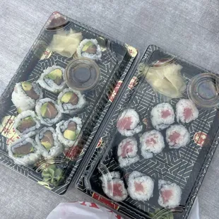 two trays of sushi