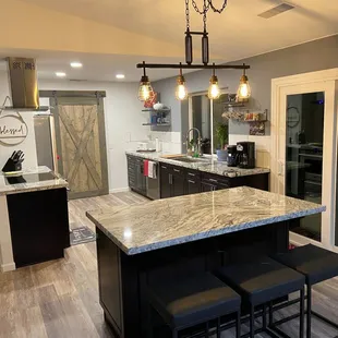 Cabinets, hardware and granite fabrication and install provided by KHL.