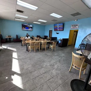 Seating area around the corner from where you order the food.