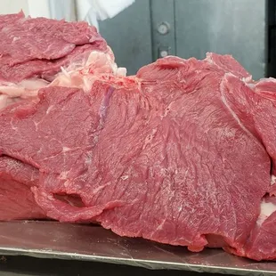 raw meat on a metal tray