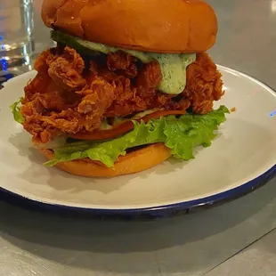 Fried chicken sandwich herb aoli sauce.