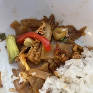 Drunken noodles with a side of white rice.