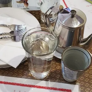 a table setting with silverware and utensils