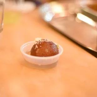 a small bowl of food on a table