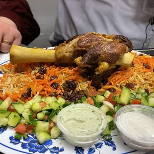 a plate of food with meat and vegetables