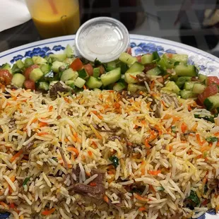 a plate of rice and vegetables