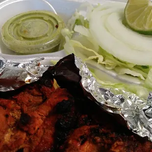 Chicken Tikka with chutney and sides.