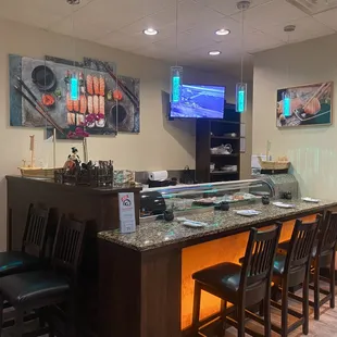 a sushi bar with chairs