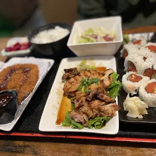 3 item bento with chicken teriyaki, pork katsu, and a spicy tuna roll