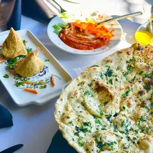 Vegetable Samosa  , Garlic Naan and Butter Chicken.