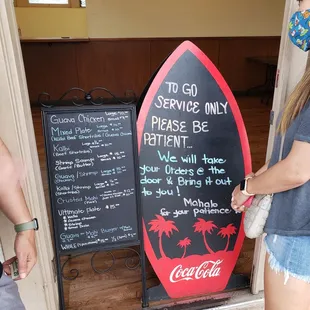 a woman holding a surfboard