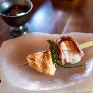 Seared wagyu wrapped scallop, blistered shishito, lion's mane mushroom, wagyu soup