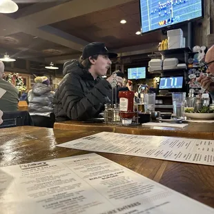 Bar area with tv and playoff football game