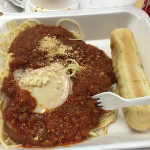 a plate of spaghetti and a hot dog