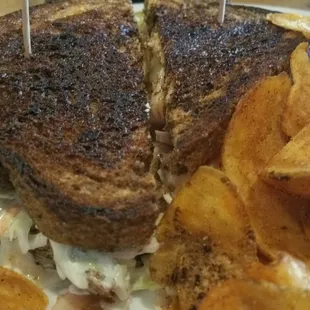 Delicious turkey rueben with their homemade chips.  Tasty offering.