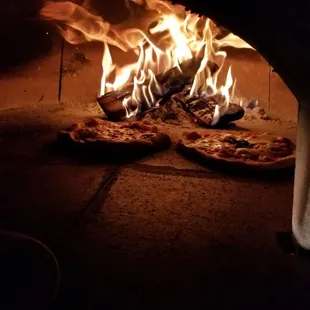 Wood fired pizza made with fresh ingredients and hand kneaded dough!
