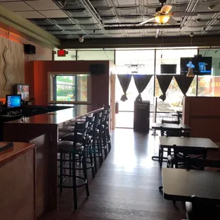 View of the small bar and dining space