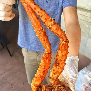  man holding a crab legs