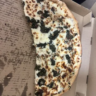 Spinach White Pizza added sausage.