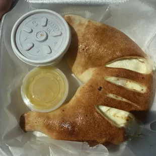 Cheese calzone. SO CHEESY it makes me soo happy just how much cheese they put in this!