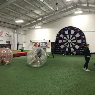 Soccer billiards, hamster balls, and Velcro giant dartboard.