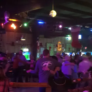 a large group of people in a bar