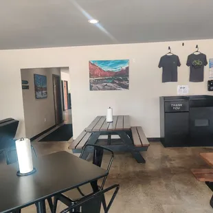 a kitchen with tables and chairs