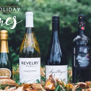 three bottles of wine in the grass