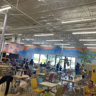 Sitting area. Lots of tables and chairs.