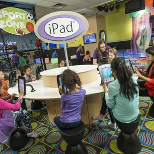 Kids Quest created a unique, multi-station iPad table to engage children of all ages in tablet play.