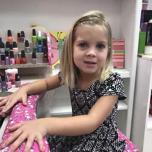 Girls haircut includes hair glitter, braid, and painted nails!